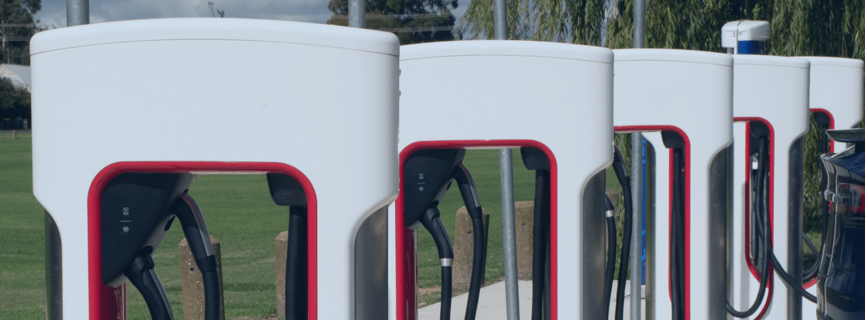 Electric vehicle charging stations supported by MasTec Communications Group infrastructure.